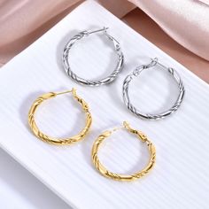 Description & Details Timeless and elegant, these easy matching tasteful twisted knot hoop earrings capture a woman's appreciation for the wonders of her everyday fashion. Fluid bands merge to form this simple yet classic design. • Material: High Quality Stainless Steel• Finish: Hypoallergenic ∙ Gold Plating• Dimensions: 32 mm each• All our work is custom made by hand with love Modern Twist Hypoallergenic Hoop Earrings, Spiral Earrings For Everyday Wear, Elegant Twisted Hoop Earrings For Everyday, Elegant Spiral Hypoallergenic Hoop Earrings, Elegant Hypoallergenic Spiral Hoop Earrings, Tarnish Resistant Twisted Jewelry, Elegant Twisted Metal Hoop Earrings, Gold Plating, Everyday Fashion