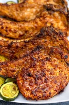 some fried food on a white plate with zucchini