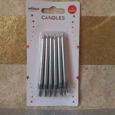 six candles are in the package on the table