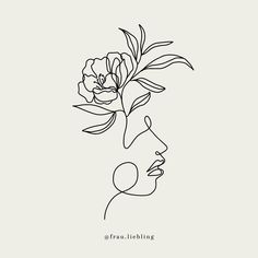 a line drawing of a woman's face with a flower in her hair