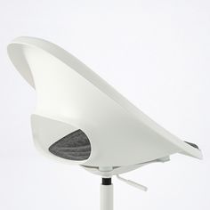 a white office chair sitting on top of a table