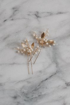 Mya Hair Pin Delicate leaves, shimmering pearls and crystal gems adorn these beautiful hair pins. These bridal hair pins look elegant when styled on their own, or pair them together to create an ethereal bridal headpiece.  Available in Gold and Silver.  Decorative portion of the hairpin is approximately 2" wide and 2" tall.  Price is for a set of two hairpins. SHIPPING: This item is handmade to order. Please see the Shipping & Policies section for production time. If you need your item sooner, p Gold Hairpiece, Gold Leaf Hair, Pearl Wedding Hair, Gold Hair Piece, Pearl Bridal Hair, Bridal Hair Pins Pearl, Boho Bridal Hair, Bridal Hair Pin, Wedding Hair Comb