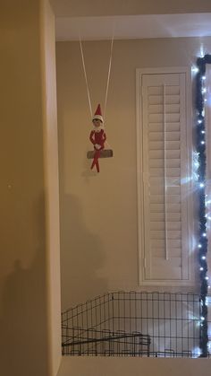 the cat in the hat is hanging on the wall next to the door and window