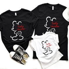 two t - shirts with mickey mouse and family vacation on them, one is black and the other is white