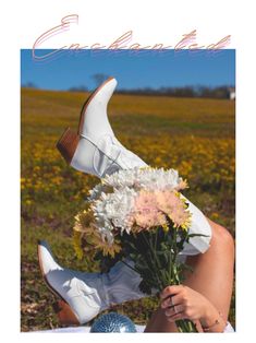 a woman sitting on the ground with flowers in her hand and a white shoe over her head