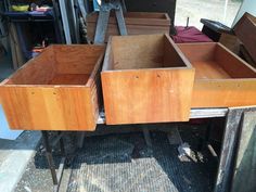 several wooden boxes are stacked on top of each other