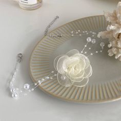 ✦ Indulge in the delicate beauty of our Elegant Pearl Bead Flower Choker Necklace. The intricate mesh flower pendant, adorned with a lustrous pearl, makes this necklace a true statement piece. The vintage-inspired design adds a touch of nostalgia and femininity to any outfit. Whether you're attending a wedding, a formal event, or simply want to express your unique style, this flower choker is a stunning choice. Gift it to someone special or wear it yourself to exude elegance and grace. ---------- DETAILS ----------- - - Color: Ivory/ Black - Materials: Fabric, Faux Pearl, Mesh - Necklace Length: 34.4cm + 5.1cm extension- SKU: HN3463 Elegant Flower-shaped Pearl Chain Necklace, Elegant Pearl Chain Flower Necklace, Elegant Flower Necklace With Pearl Chain, Elegant Pearl Flower Necklace, Elegant Flower Shaped Pearl Chain Jewelry, Elegant Silver Flower Necklace With Decoration, Elegant Pearl Flower Necklace With Pearl Chain, Elegant Pearl Flower Necklace As Gift, Elegant Flower Necklace With Pearl Chain As Gift