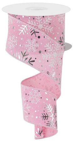 a pink ribbon with white snowflakes on it