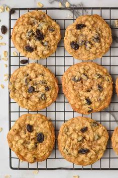 twelve oatmeal raisin chocolate chip cookies on a cooling rack