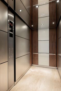 the elevator is empty and ready to be used for business purposes in this modern building