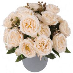 a vase filled with lots of white flowers