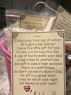 a note from a teacher to her daughter on the back of a bucket full of school supplies