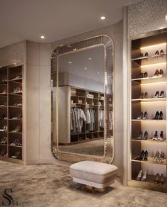 a large mirror sitting on top of a walk in closet next to a white bench