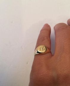 "Pinky ring, Engraved ring, Initial Ring, Personalized Ring Engraved Signet ring with Round Seal- Best quality 18k Gold Plate Engraved 1 letter - Vintage style Diameter: 0.7 mm = 0.27\" Please note in the \"notes to seller\" at checkout. : * state your ring size * letter you want to apper The product will arrive to you packed in gift box and padded envelope to maintain the product Our jewelry are water resistant and comes with 1 year warranty Thank you for your interest. Please check out our oth Everyday Open Ring With Initials, Engraved Initial Ring For Everyday, Stamped 14k Initial Ring For Everyday, Everyday Engraved 14k Ring, Vintage Initial Ring For Promise, Vintage Adjustable Initial Ring For Promise, Promise Ring With Engraving, Vintage Promise Ring With Initials, Vintage Initials Promise Ring