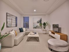 a living room filled with furniture and a flat screen tv