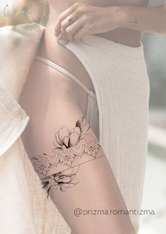 a woman with a flower tattoo on her arm