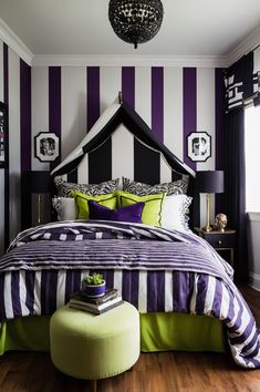 a bedroom with purple and white stripes on the walls, green pillows, and a large bed