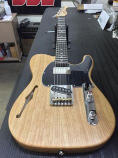 an electric guitar sitting on top of a table