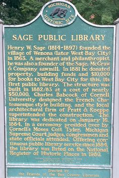 the sage public library marker is located in front of some trees and bushes, with an elephant on it's back