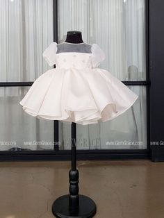 a dress on display in front of a window