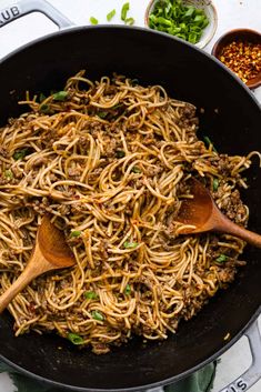 a skillet filled with noodles and meat