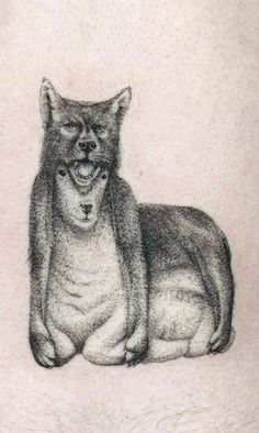 a black and white drawing of a cat on the back of a woman's stomach