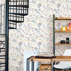 a room with a spiral staircase next to a desk and bookshelf in it