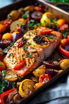 salmon and vegetables in a pan on a table