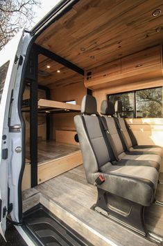 the interior of a van with seats in it