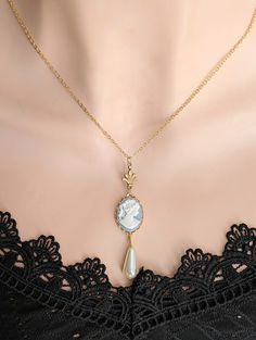 Indulge in the charm of a bygone era with our exquisite Pearl Cameo Necklace, a stunning blend of historical allure and Art Deco opulence. This 14K gold-plated pendant pays homage to romantic vintage aesthetics, making it the perfect accessory for those who appreciate timeless beauty. ✨ **Key Features - **Pearl Cameo Pendant Intricately detailed, capturing the essence of grace and sophistication. - **14K Gold Plating A luxurious touch, adding warmth and richness to the delicate design. - **Histo Cameo Earrings, Vintage Inspired Jewelry, Cameo Necklace, Small Shops, Cameo Pendant, Deco Jewelry, Historical Costume, Gift For Wife, Art Deco Jewelry