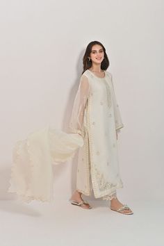 An all white affair, designed on pure cotton net with elegant ivory ari work alongside pearls and sequins handwork details. A gorgeous gorgeous three piece that is a must have in every wardrobe. Anarkali Sets With Pearl Embroidery In Cream, Cream Sets With Pearl Embroidery For Eid, White Traditional Wear With Pearl Embroidery For Festive Occasion, Festive White Traditional Wear With Pearl Embroidery, Elegant Off White Anarkali Set For Party, Elegant Off White Embroidered Sets, Cream Sharara With Pearl Embroidery For Eid, Elegant Off White Georgette Sharara, Elegant Off-white Georgette Sharara