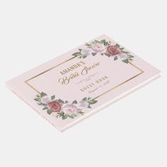 a pink book with flowers on the cover and gold lettering that reads, person's beauty planner