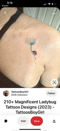 the back of a woman's stomach with tattoos on it and an image of a dandelion