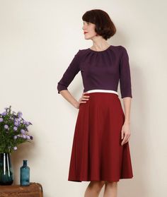 "Simple elegance! A beautiful spring dress is made of thicker knit fabric with a wide skirt and 7/8 sleeves. Especially nice is the pleated neckline. The bodice in violet is form-fitting and the skirt in bordeaux swings at each movement of the loose-fitting form. With a waist stripe in offwhite. Size / Weight / Length: variable from 90-110 cm (100 cm in the photo) \"Lucy\" is available in sizes 36-44. materials Viscose, Spandex Care instructions: Wash at 30 degrees, iron hot from left Production Plated Skirt, Round Skirt, Beautiful Spring Dresses, Tiffany Dresses, Wide Skirt, Different Colours, Spring Dress, Simple Elegance, Beautiful Dress