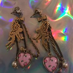 Long Dangle Chain Earrings With Fairy Charms Pink Rose Bud Hearts Pearls Bows Crystal Rhinestone Vintage Betsey Johnson Pink Whimsical Metal Jewelry, Whimsical Pink Metal Jewelry, Feminine Pink Gold Jewelry For Party, Pink Dangling Charms Drop Earrings, Pink Drop Earrings With Dangling Charms, Whimsical Jewelry With Dangling Charms For Party, Pink Whimsical Pierced Earrings, Whimsical Drop Earrings For Valentine's Day, Whimsical Rose Gold Jewelry For Party