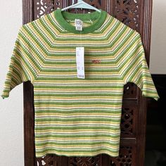 Nwt. Urban Outfitters 70’s Style Green Stripped Ribbed T Shirt. Size Med. Top- Bottom 19 Inches Pit-Pit 13 Inches Retro Striped Ribbed Tops, Retro Ribbed Striped Tops, Retro Ribbed Summer Top, Retro Ribbed Tops For Summer, Retro Green Tops For Fall, Vintage Ribbed Crew Neck Tops, Vintage Ribbed Cotton Tops, Vintage Striped Fitted Tops, Vintage Fitted Striped Tops