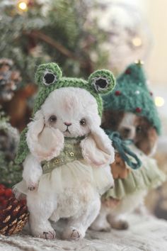 two small dogs dressed up in christmas outfits