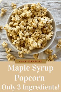 a white bowl filled with maple syrup popcorn on top of a wooden table