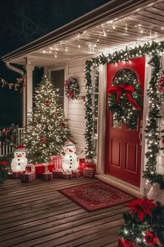 christmas decorations on the front porch of a house