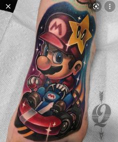 mario kart tattoo on the left arm and foot, with an image of mario kart