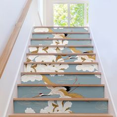 the stairs are decorated with flowers and birds