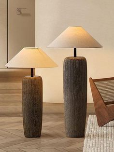 two lamps sitting next to each other in a room