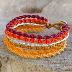 Shimmering beads of silver harmonize with shades of orange yellow red and brown in the design of this wristband bracelet. Thailand's Napapat crafts her design by hand with macrame techniques resulting in a bracelet of wondrous allure. .950 Silver Crochet Bracelet Pattern, String Bracelet Patterns, Macrame Bracelet Patterns, Friendship Bracelets Tutorial, Bracelets Handmade Diy, Bracelets Design, Diy Bracelets Patterns, Wristband Bracelet, Seed Bead Tutorial