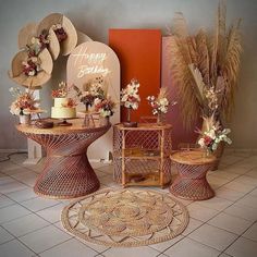 the table is decorated with flowers and straw hats on it's head, along with other decorations