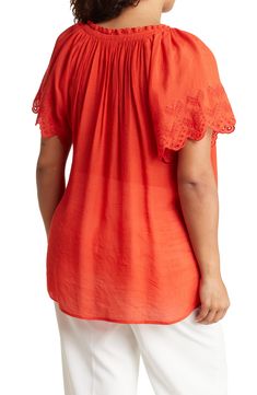 Intricate eyelet embroidery frames the sleeves and neckline of this lightweight blouse. 30" length (size 1X) Ties at neck Short sleeves 65% rayon, 35% polyester Hand wash, dry flat Imported Model stats: 5'10" height, 41" bust, 36" waist, 48" hip. Model is wearing size 1X. Summer Eyelet Blouse With Relaxed Fit, Relaxed Fit Eyelet Blouse For Summer, Casual Rayon Tops With Lace Trim, Short Sleeve Eyelet Tops With Relaxed Fit, Relaxed Fit Eyelet Top With Short Sleeves, Relaxed Fit Short Sleeve Eyelet Top, Eyelet Tops With Relaxed Fit For Daywear, Rayon Tops For Daywear, Relaxed Fit Eyelet Tops For Daywear