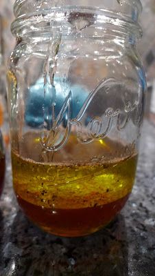 a jar filled with liquid sitting on top of a counter