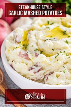 a white bowl filled with mashed potatoes on top of a table