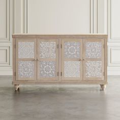 the sideboard is made out of wood and has glass panels on each side, along with