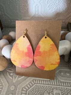 These sunny and warm pastel earrings will brighten the best of days! Spring Multicolor Hand-painted Jewelry, Artsy Summer Earrings With Ear Wire, Hand Painted Yellow Earrings For Summer, Pastel Summer Jewelry Gift, Trendy Pastel Earrings For Gift, Colorful Spring Earrings For Gifts, Colorful Spring Earrings For Gift, Hand Painted Multicolor Summer Earrings, Hand Painted Multicolor Earrings For Summer