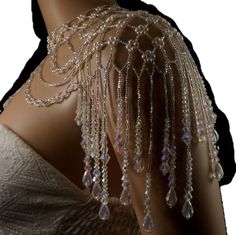 the back of a mannequin with beads and chains on it